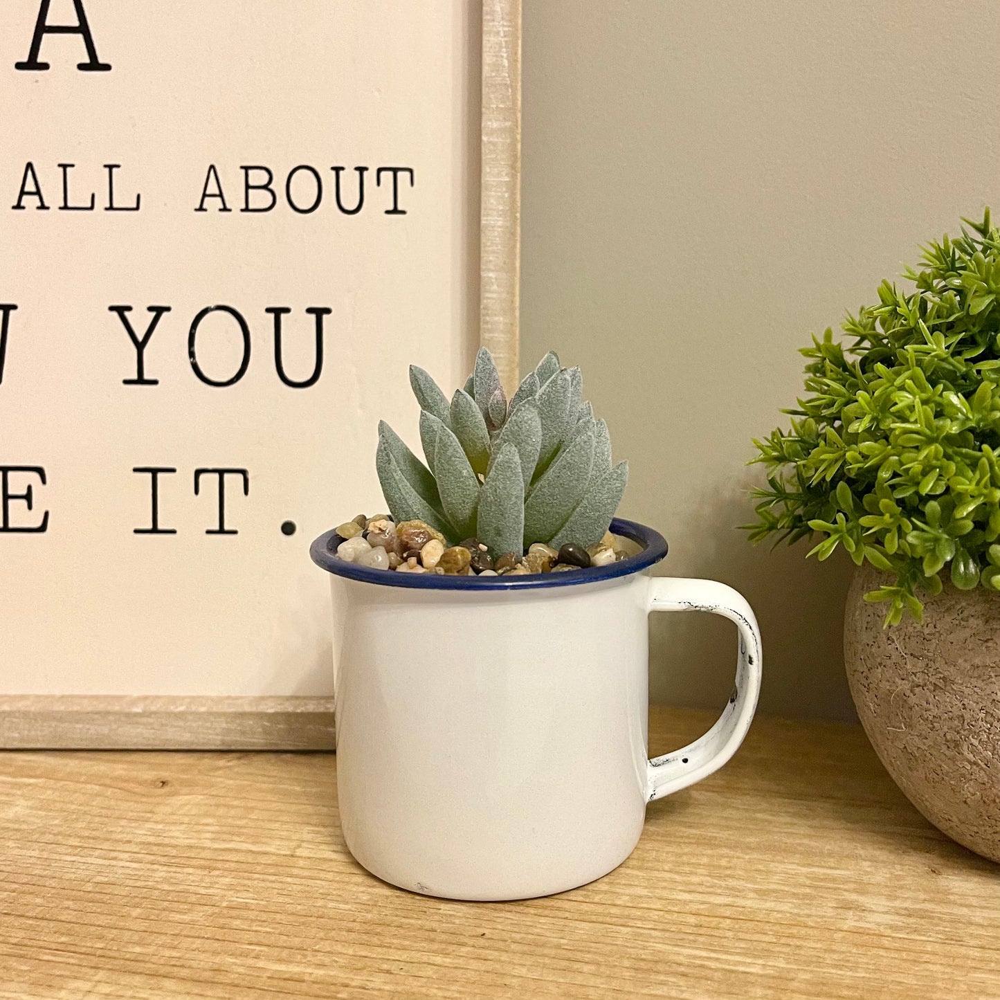 Artificial succulent in a cup