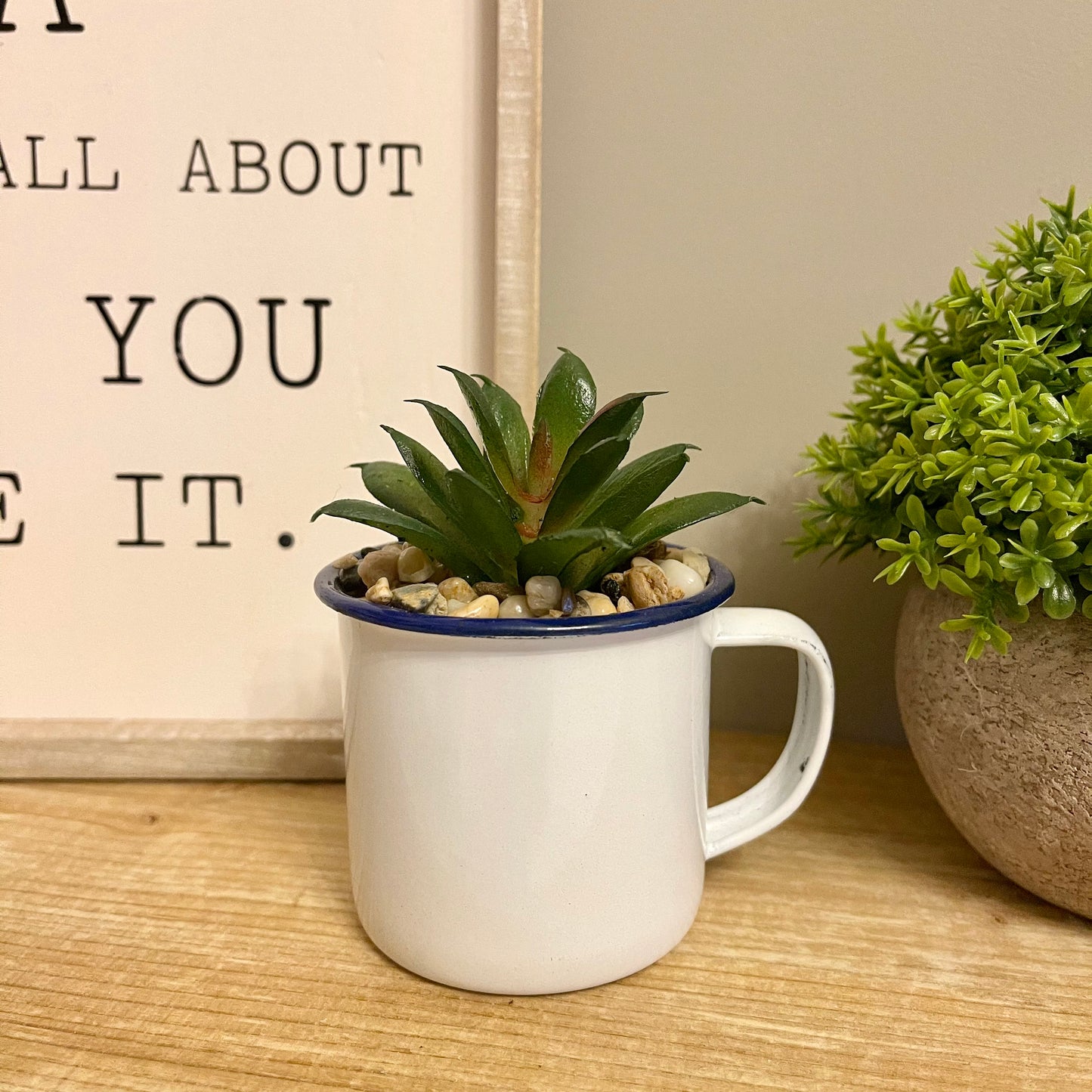 Artificial succulent in a cup