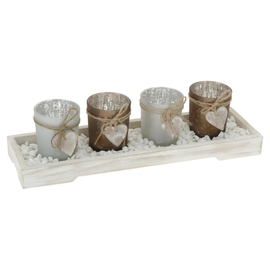 Glass candle holders on wooden tray