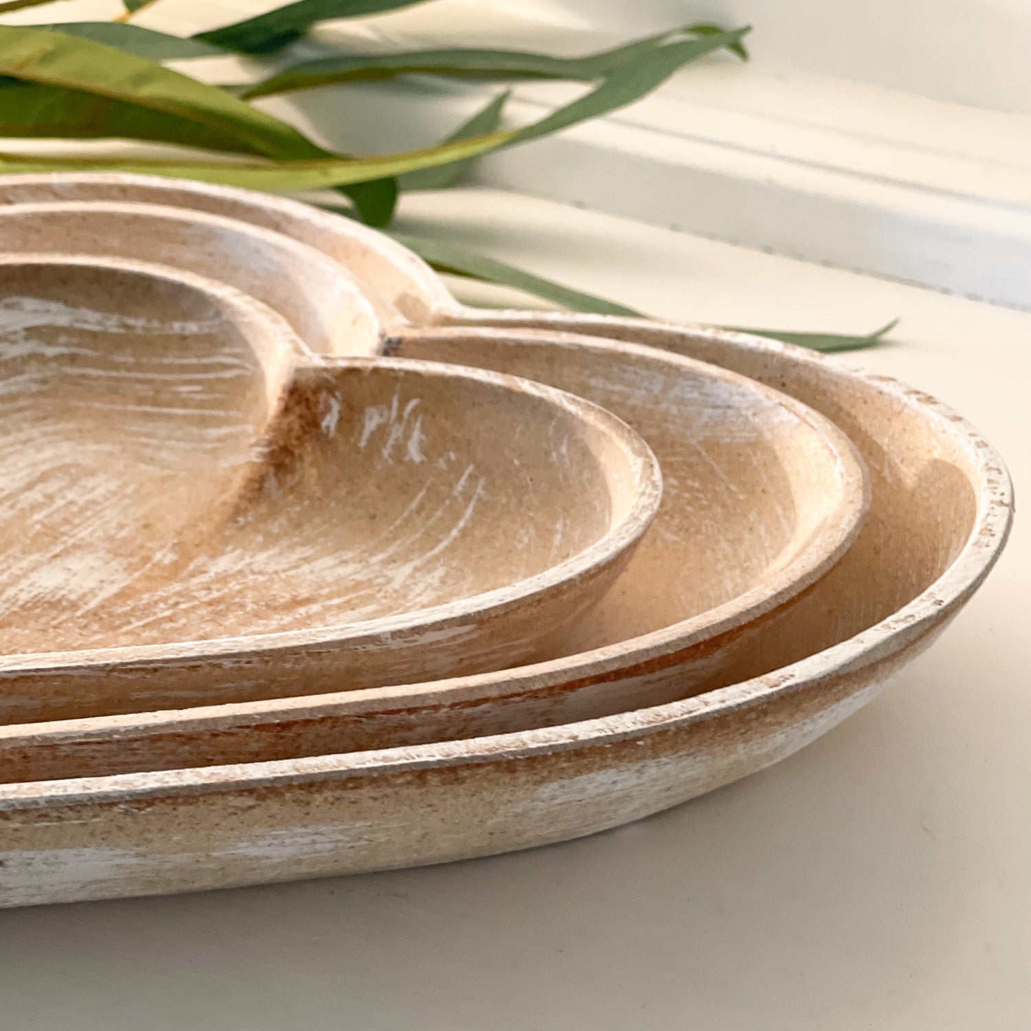 Home at no.7 rustic wooden heart shaped dishes close up